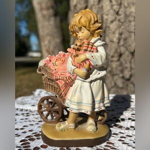 Lisi Martin figurine for Dolfi, titled "Girl with Kitten and Stroller"